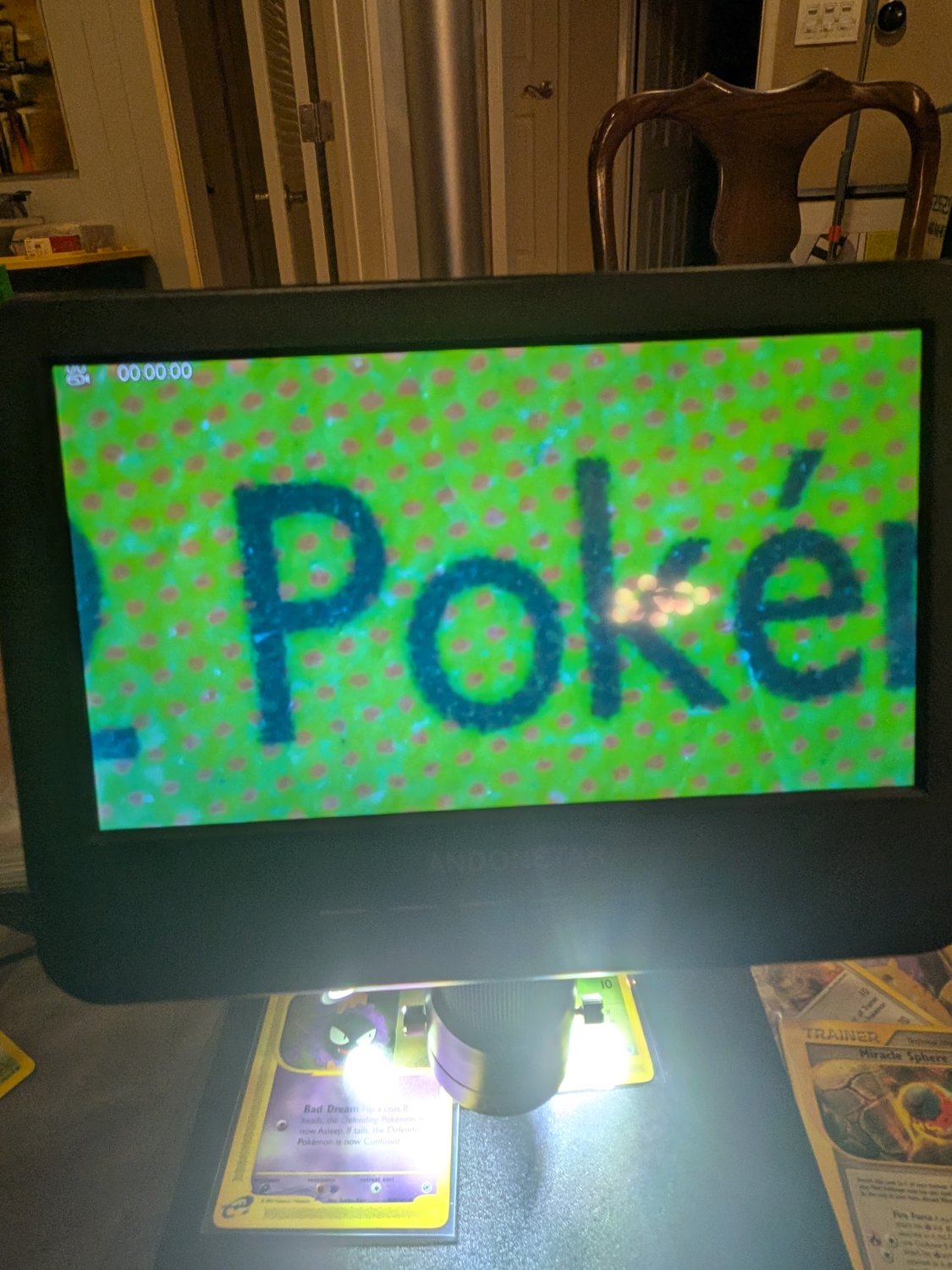 Digital microscope displaying a magnified view of card printing